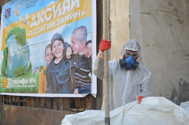 A worker puts pesticides into UN Big Bag, Ziraki, Tajikistan, Environmental Health and Pollution Management Institute, EHPMI, Peshsaf