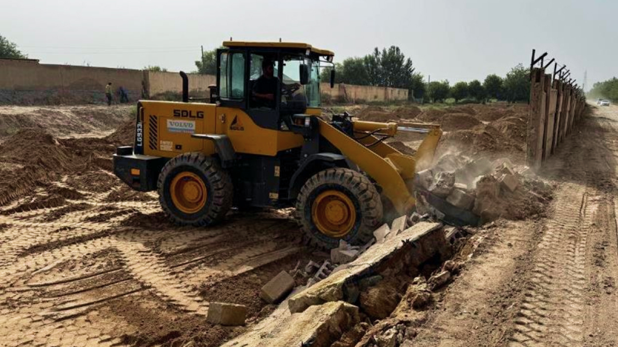 The process of demolishing fencing in a contaminated area